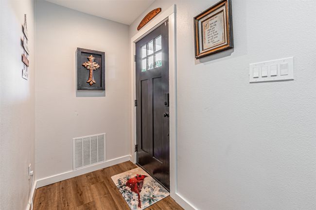 Doorway to outside with wood finished floors and baseboards | Image 4
