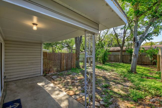 View of fenced backyard | Image 36