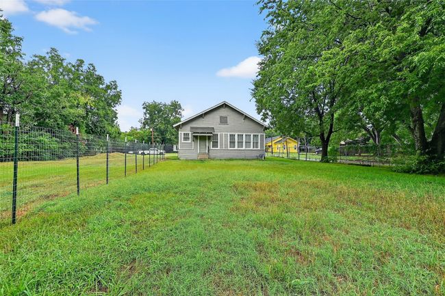 View of yard with view of wooded area | Image 19