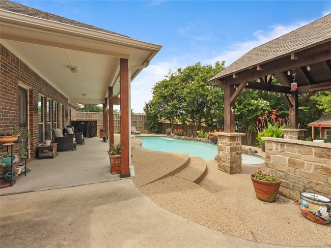 View of pool featuring a gazebo, a patio, and a fenced backyard | Image 21