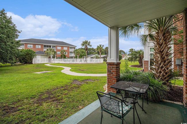 View of yard, leading to outdoor pool | Image 16