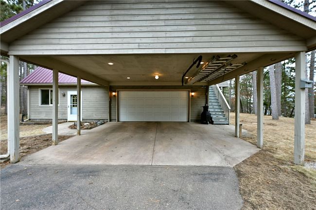 Spacious carport is great for functional parking, but also for outdoor entertaining! | Image 39