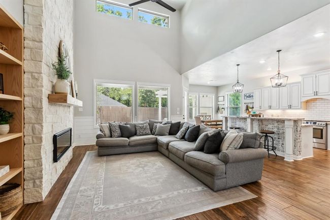 The family room flows seamlessly into the kitchen and breakfast room, creating an ideal layout for entertaining. | Image 10
