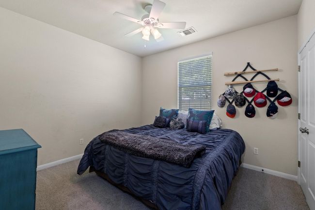 Bedroom , baseboards, and ceiling fan | Image 25