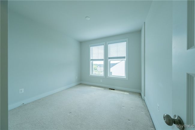 Carpeted spare room featuring baseboards | Image 31