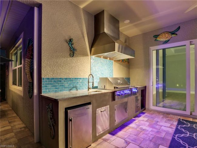 View of patio with area for grilling, grilling area, and sink | Image 43