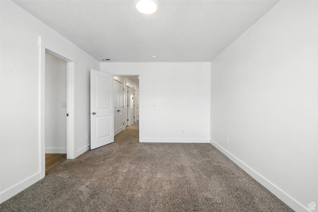 Carpeted spare room featuring baseboards | Image 19