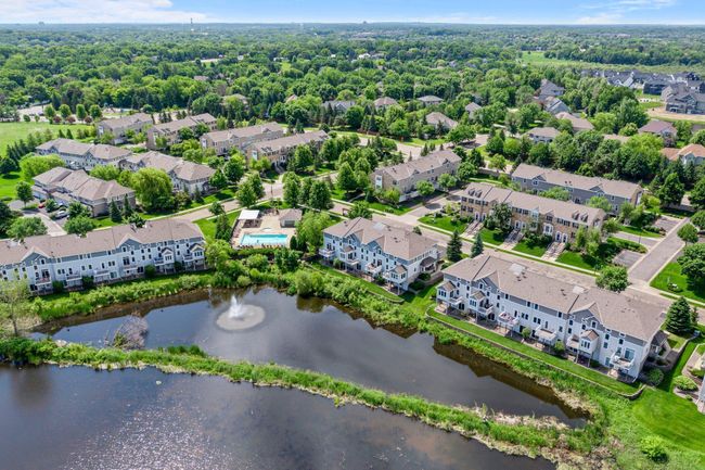 It truly is a beautiful area with the fountain as a centerpiece and pool next to home! | Image 54