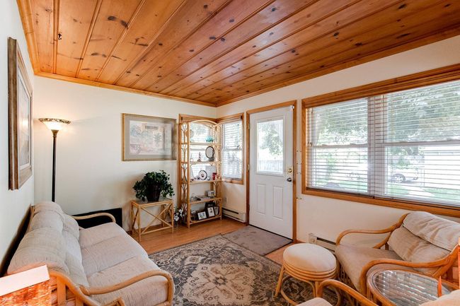 Enjoy Morning Coffee in Sunroom | Image 11