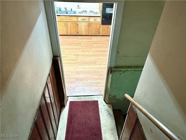 View of staircase to lower level | Image 6