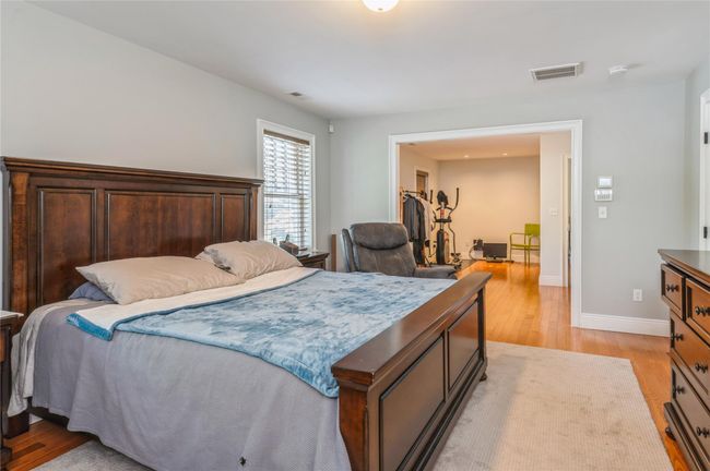 Primary Bedroom featuring light wood-type flooring and baseboards | Image 14