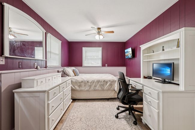 Bedroom featuring an office area and a ceiling fan | Image 25