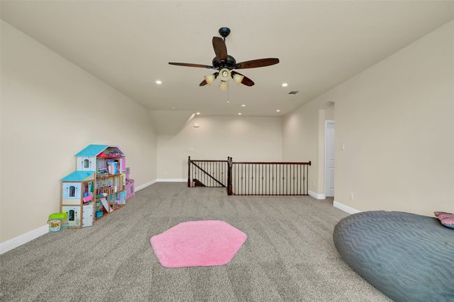 Recreation room featuring carpet, recessed lighting, and a ceiling fan | Image 35