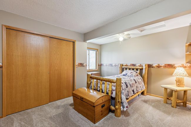 This is the 2nd of 3 main level bedrooms with newer soft, neutral color carpeting | Image 19