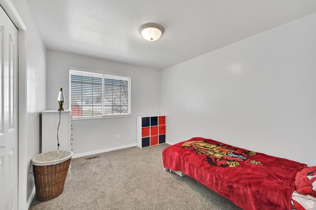 Bedroom featuring baseboards, visible vents, and carpet | Image 20