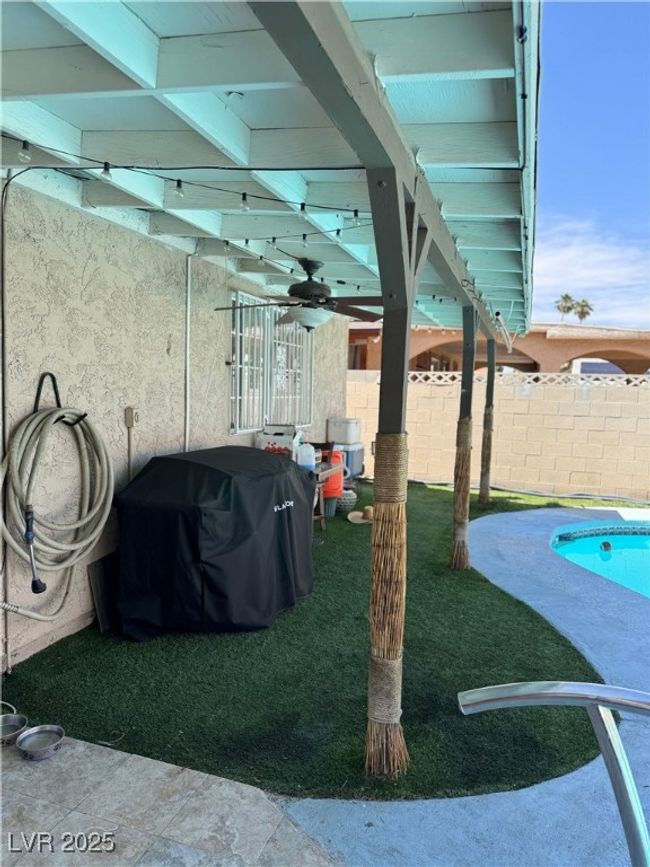View of patio / terrace featuring a grill and ceiling fan | Image 15