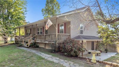 View of front of property with a front lawn and a porch | Image 1