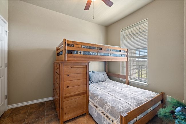 Bedroom with ceiling fan and baseboards | Image 22