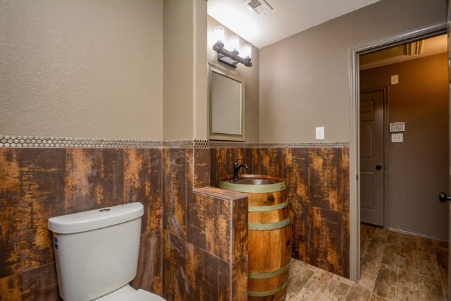 Walls are embellished with tile details. | Image 24