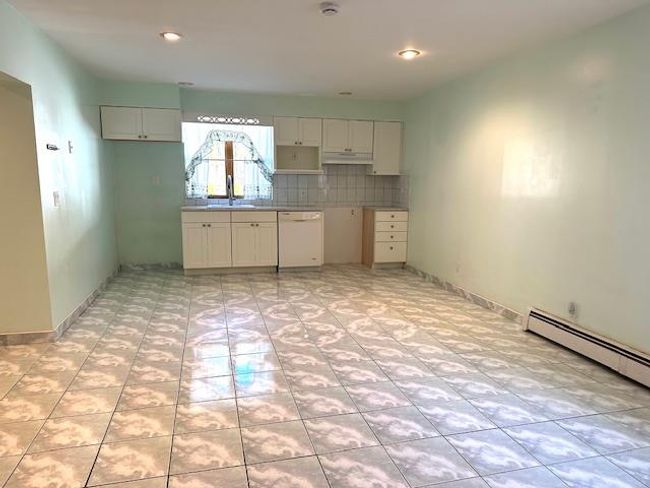 Kitchen featuring white dishwasher, sink, and white cabinets | Image 22