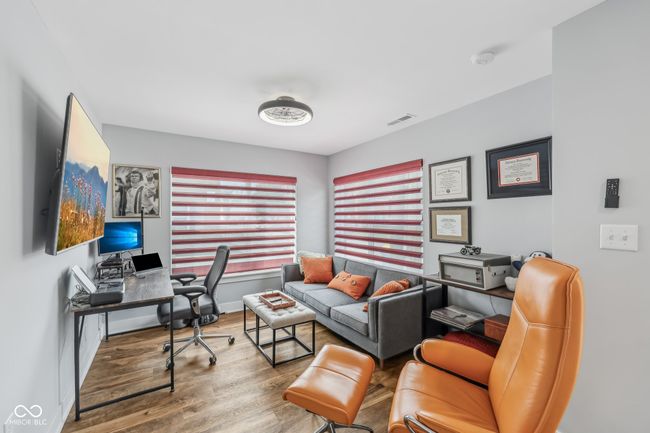 office space featuring baseboards, visible vents, and wood finished floors | Image 12