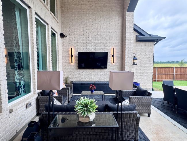 View of patio with an outdoor hangout area | Image 36