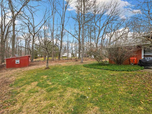 View of yard featuring a shed | Image 36