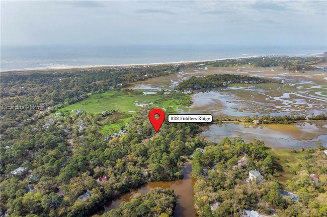 Hightide water view in front of home beyond the berm. | Image 9