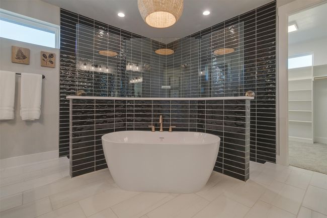 Bathroom with tile patterned flooring, tile walls, and plus walk in shower | Image 18