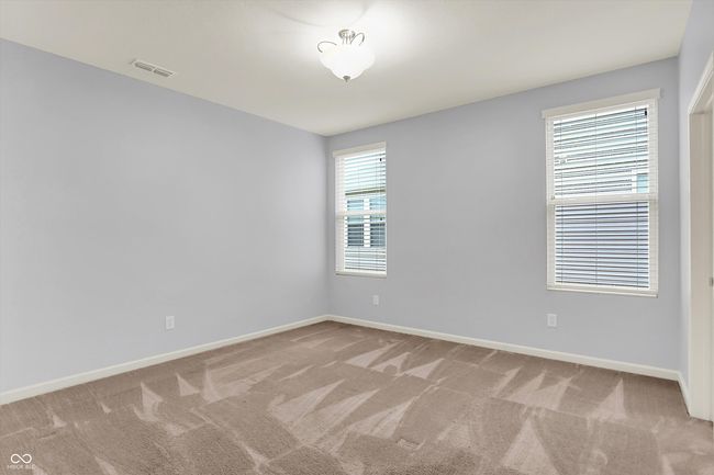 unfurnished room featuring light colored carpet | Image 10