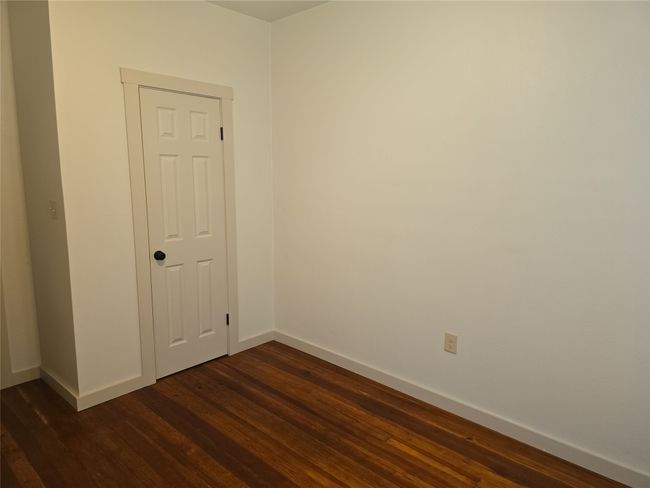 Unfurnished room with baseboards and dark wood finished floors | Image 29