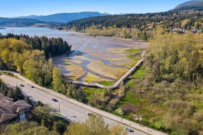Bird's eye view with a wooded view and a water and mountain view | Image 33