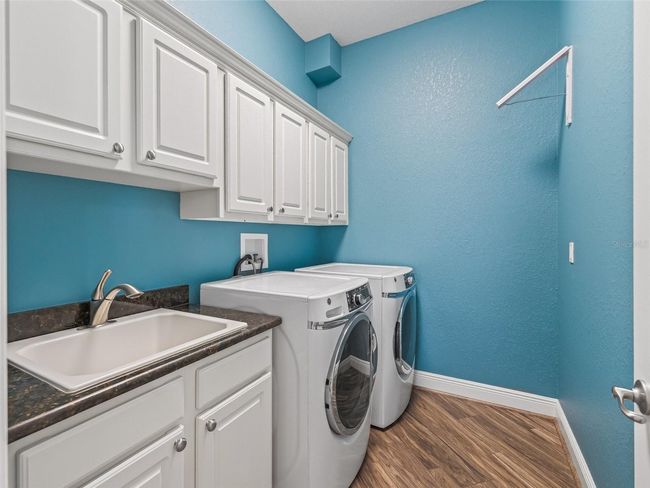Inside laundry w/Utility sink & Extra cabinets | Image 50