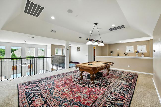 Rec room with plenty of natural light, carpet floors, billiards, lofted ceiling, and recessed lighting | Image 20