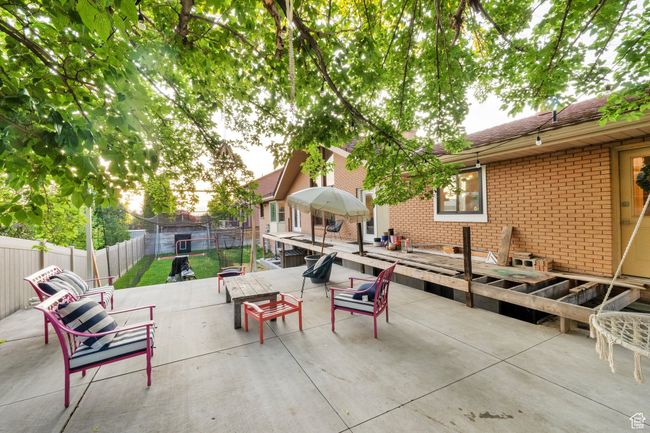 Fenced backyard featuring a patio area | Image 38
