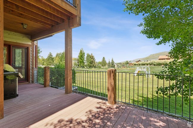 Deck featuring a yard and a mountain view | Image 68