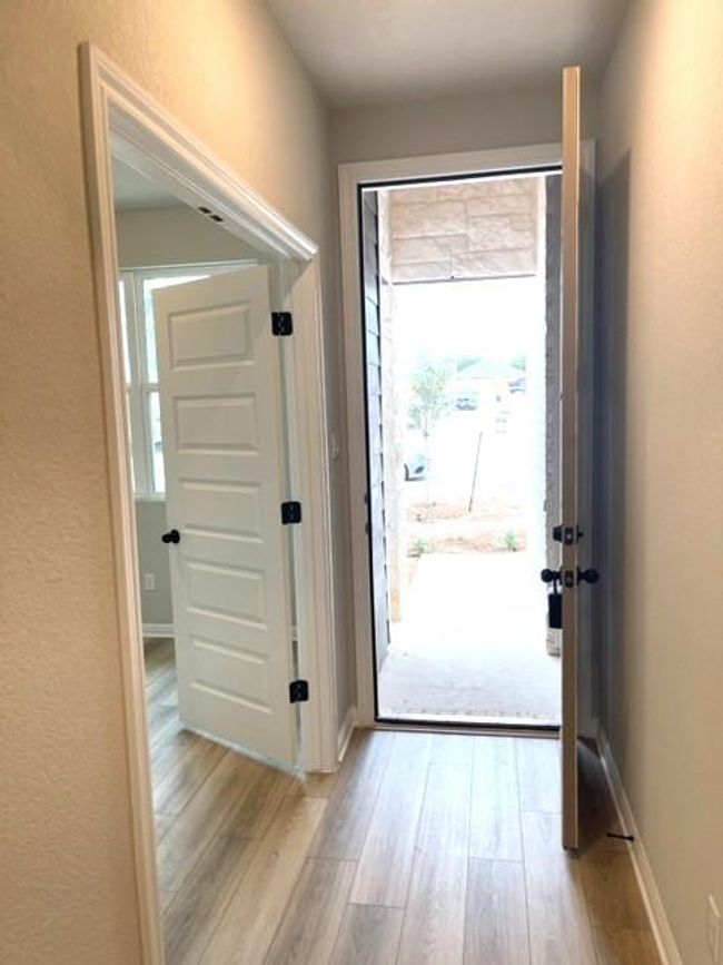 Doorway to outside with light wood-style flooring and plenty of natural light | Image 11