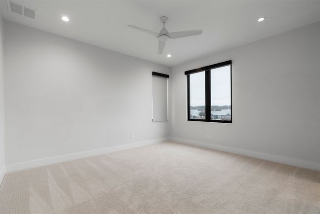 Each guest room features neutral toned walls, a ceiling fan, and carpet flooring allowing you to personalize them with ease | Image 24