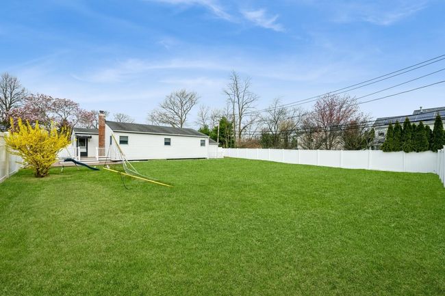 View of yard with a fenced backyard | Image 17