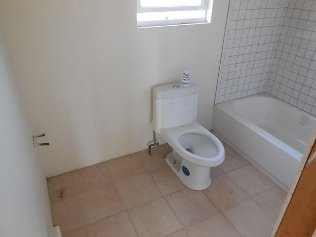 Bathroom featuring tile patterned floors, toilet, a shower, and a bathing tub | Image 12