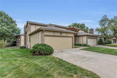 View of front of home featuring a garage and a front lawn | Image 3