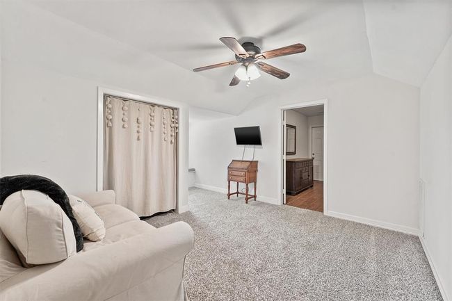 Spacious upstairs guest suite featuring a cozy sitting area —perfect for relaxing, reading, or creating a private retreat for long-term guests. | Image 14