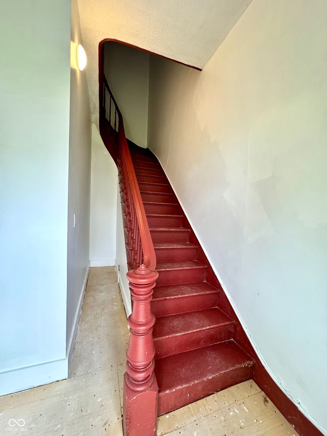 stairway with baseboards to unit #1 | Image 4