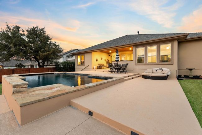 Backyard Oasis with Sparkling Pool, Pergola, and Outdoor Kitchen | Image 33
