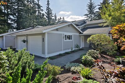 2 Car garage and established landscaping. | Image 2