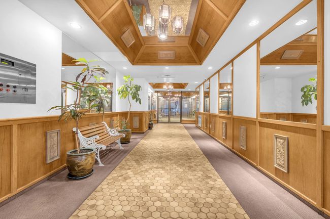 Corridor featuring recessed lighting, a notable chandelier, carpet, and wainscoting | Image 5