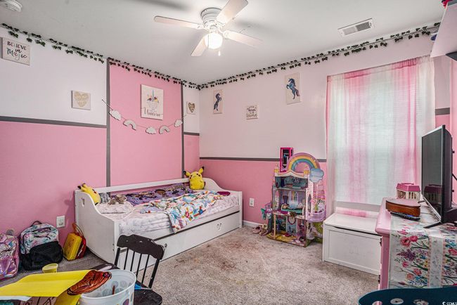 Bedroom featuring carpet floors and a ceiling fan | Image 15
