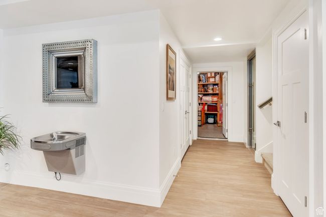 Hall with light wood-style floors and recessed lighting | Image 68