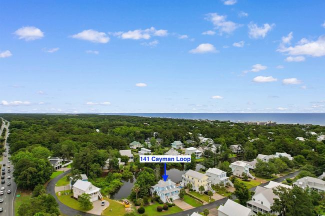 Aerial view of property and surrounding area featuring a large body of water and a heavily wooded area | Image 37