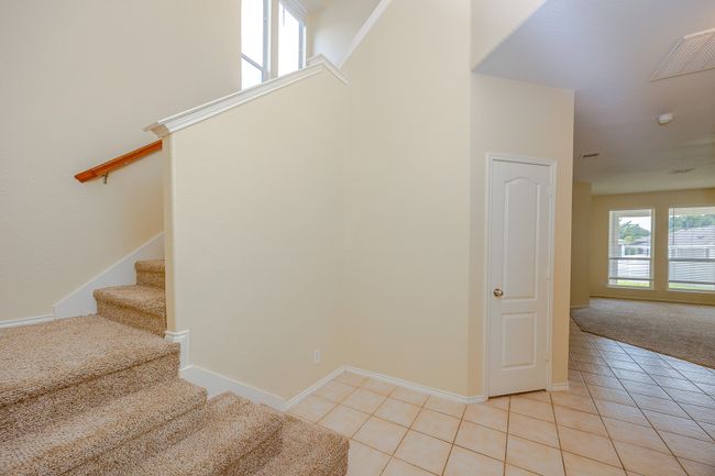 Stairs with tile patterned flooring and carpet flooring | Image 20